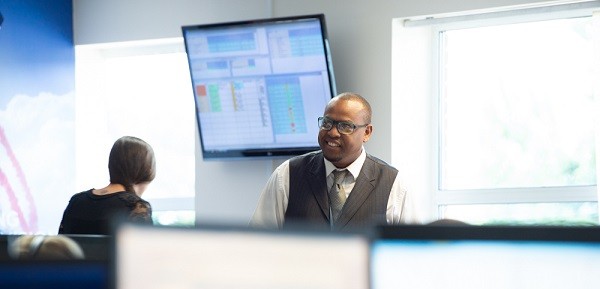 Male and female call centre agents with headsets