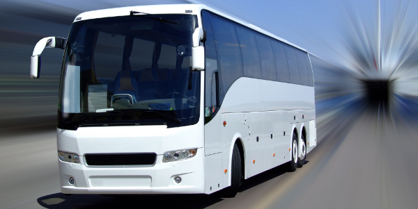 White passenger coach with motion blur background
